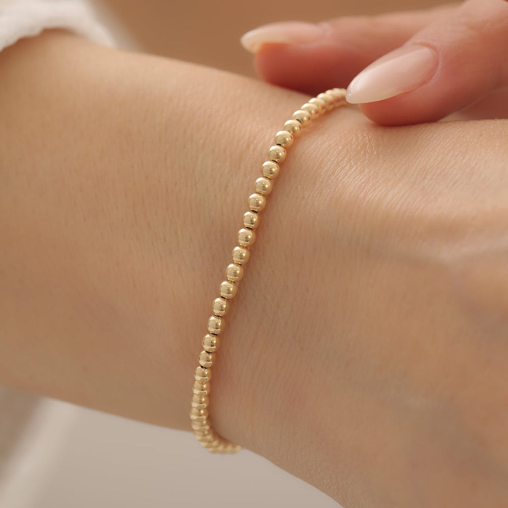 REIHENKUGEL-DESIGN ARMKETTE | 14K GOLD