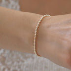 DORICA-KUGEL-REIHENOHRRINGE ARMKETTE | 14K GOLD