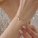 BÜROKLAMMER-, HERZ- UND GLÄNZENDES DORIKA-ARMBAND | 14K GOLD