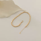 ARMBAND MIT REIHENFÖRMIGEN WÜRFEL- UND DORIKA-DETAILS | 14K GOLD