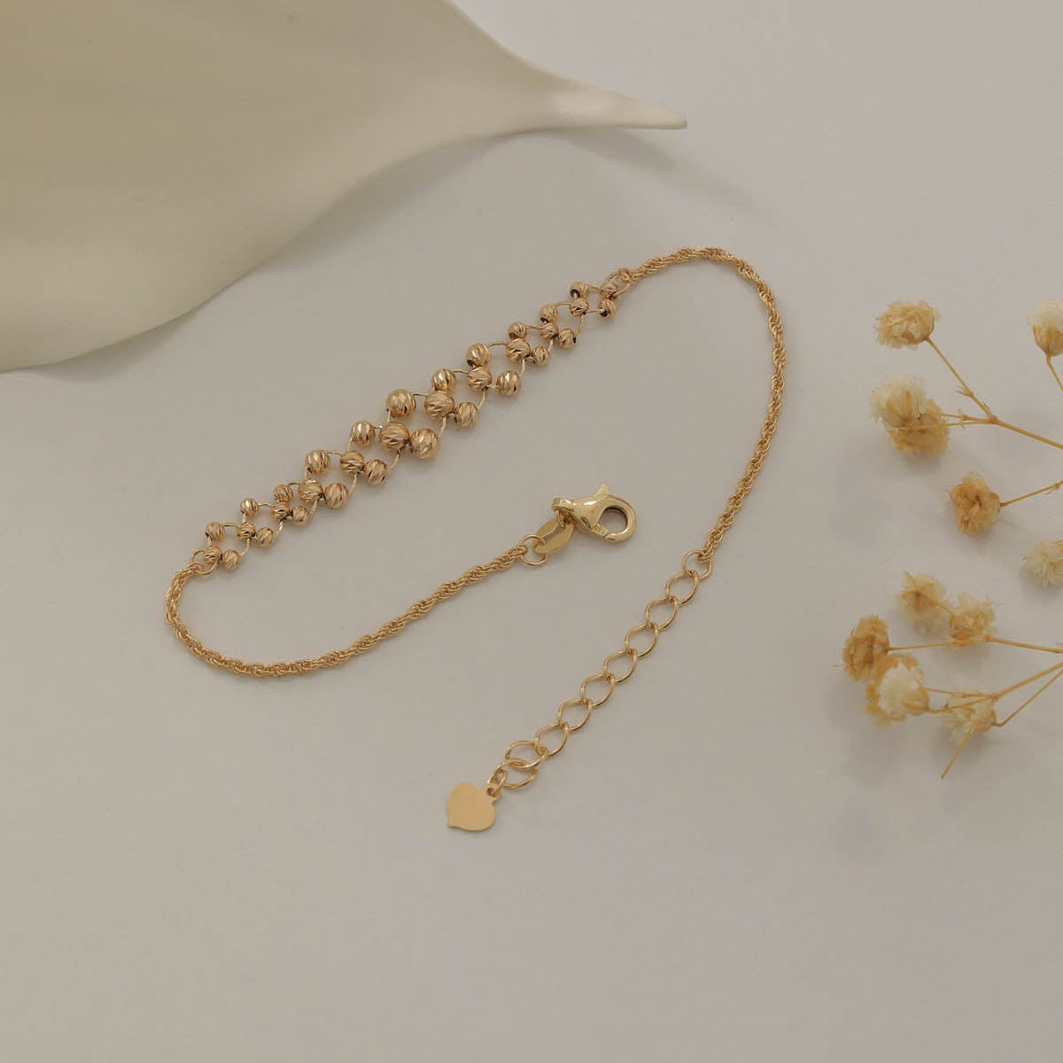 DORICA KUGEL-MIT SEILKETTEN- UND FLECHTDESIGN ARMKETTE | 14K GOLD