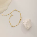 ARMBAND MIT DORIKA-KUGELN UND SEILKETTEN-DESIGN | 14K GOLD