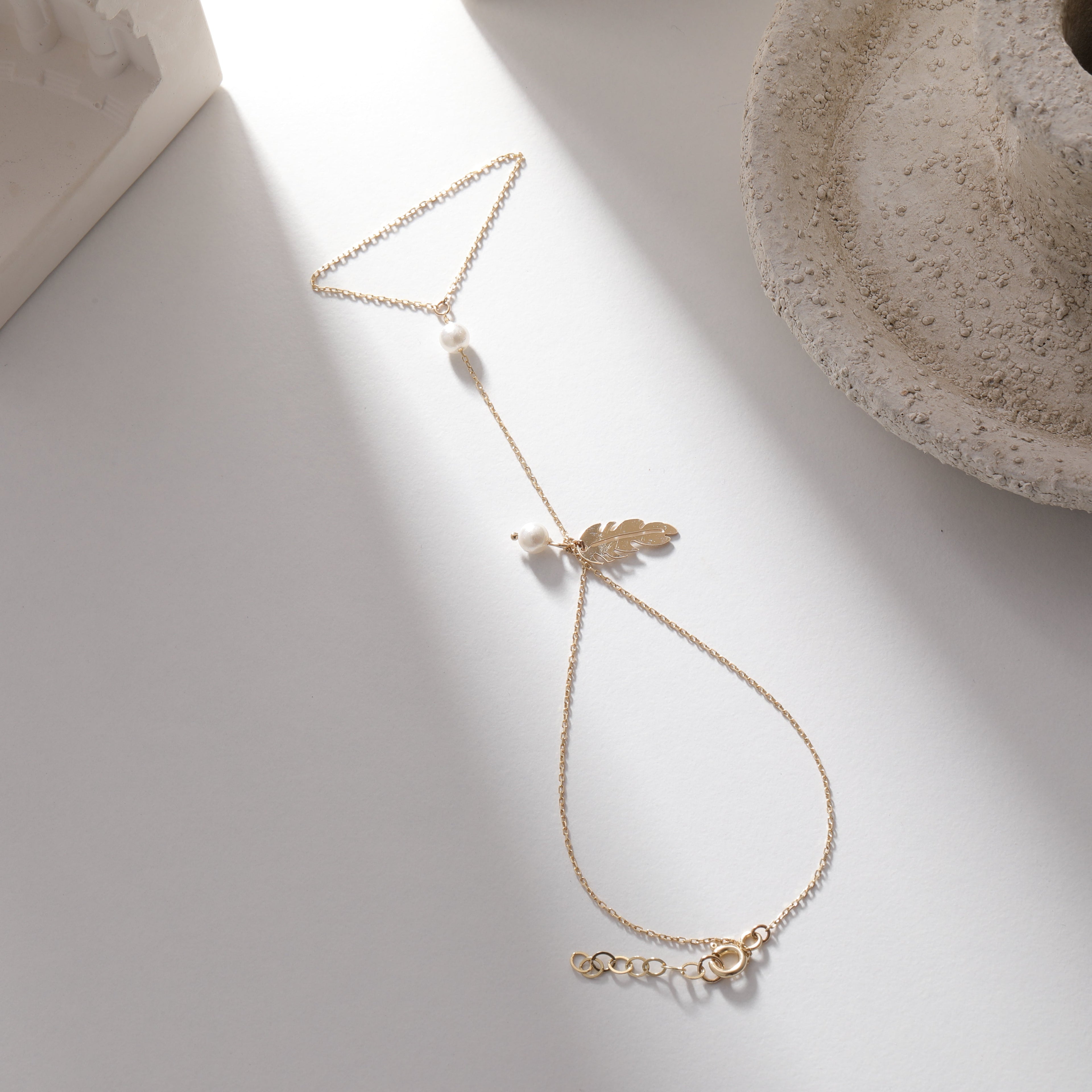 PERLENVOGEL-FEDER HANDKETTE | 14K GOLD