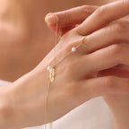 PERLENVOGEL-FEDER HANDKETTE | 14K GOLD