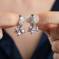 ZIVA Ohrringe aus 925 Silber von AURIME, elegante silberne Ohrstecker auf weißem Hintergrund, detailreiche Schmuckstücke
