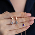 VIOLET Set aus 925 Silber von AURIME, elegante Schmuckstück mit violetten Edelsteinen, auf einem weißen Hintergrund fotografiert.