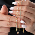 Silberne ICED X COLORFULL Kette aus 925 Silber mit bunten Steinen, von AURIME, liegt auf hellem Hintergrund.