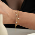Infinity Elya Armband aus 925 Silber von Aurime, detailliertes silbernes Schmuckstück mit eleganten Designs.
