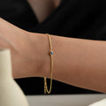 Mini dunkelblaues Nazar-Armband aus 925 Silber von AURIME, zeigt traditionelles Schutzsymbol mit blauer Perle.